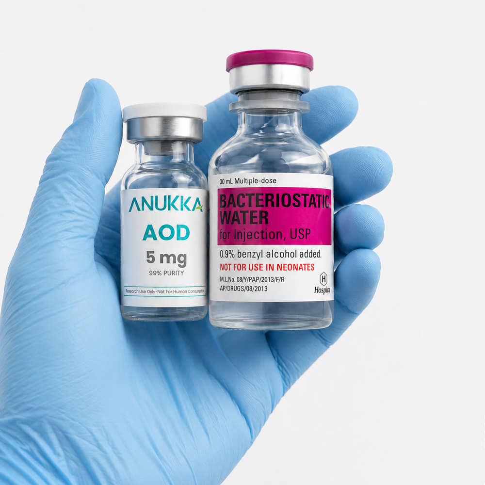 ANUKKA vials held in a blue-gloved hand