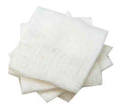 Stack of white gauze pads on a white background